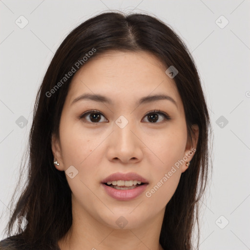 Joyful asian young-adult female with long  brown hair and brown eyes