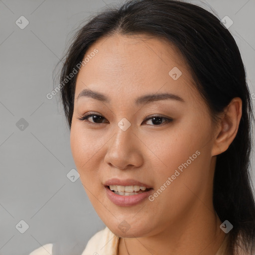 Joyful asian young-adult female with long  brown hair and brown eyes