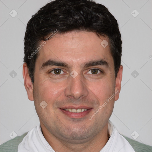 Joyful white young-adult male with short  brown hair and brown eyes