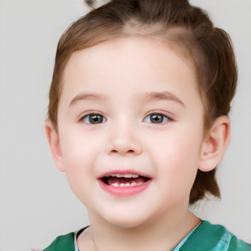 Joyful white child female with short  brown hair and grey eyes