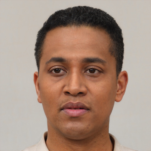 Neutral latino young-adult male with short  black hair and brown eyes