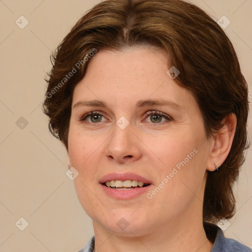 Joyful white adult female with medium  brown hair and brown eyes