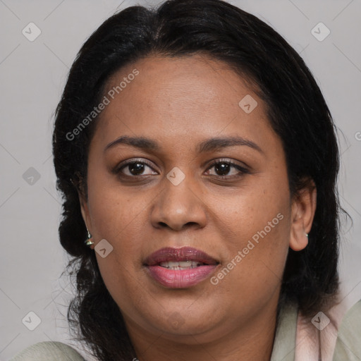 Joyful black adult female with medium  brown hair and brown eyes