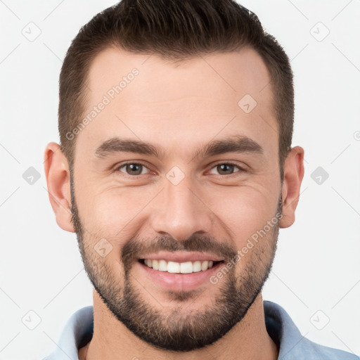 Joyful white young-adult male with short  brown hair and brown eyes