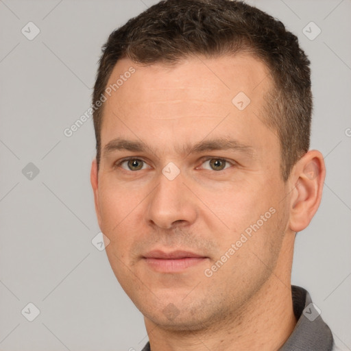 Joyful white adult male with short  brown hair and brown eyes