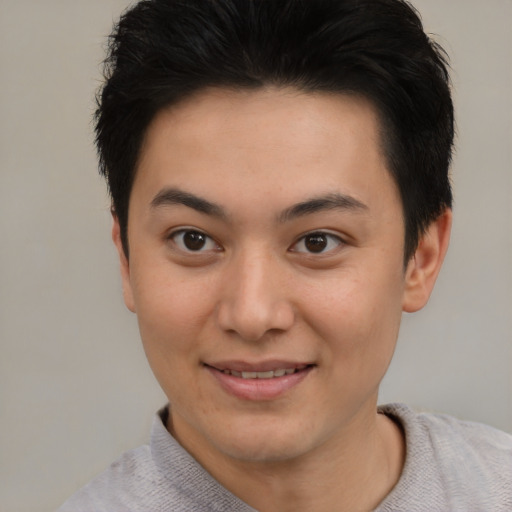Joyful asian young-adult female with short  brown hair and brown eyes