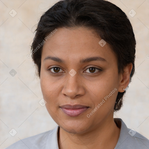 Joyful latino young-adult female with short  brown hair and brown eyes