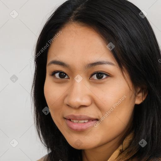 Joyful latino young-adult female with long  brown hair and brown eyes