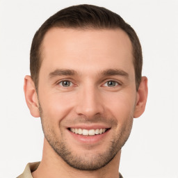 Joyful white young-adult male with short  brown hair and brown eyes