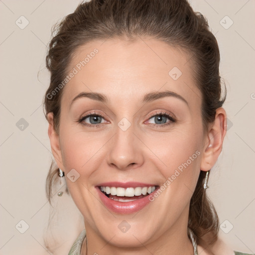 Joyful white young-adult female with medium  brown hair and grey eyes