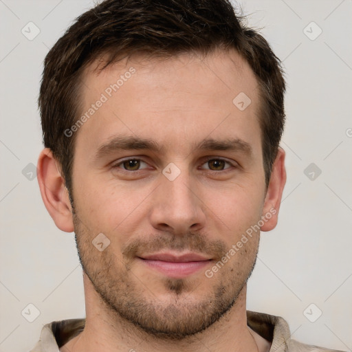 Joyful white young-adult male with short  brown hair and grey eyes