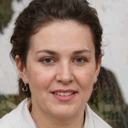 Joyful white adult female with short  brown hair and brown eyes