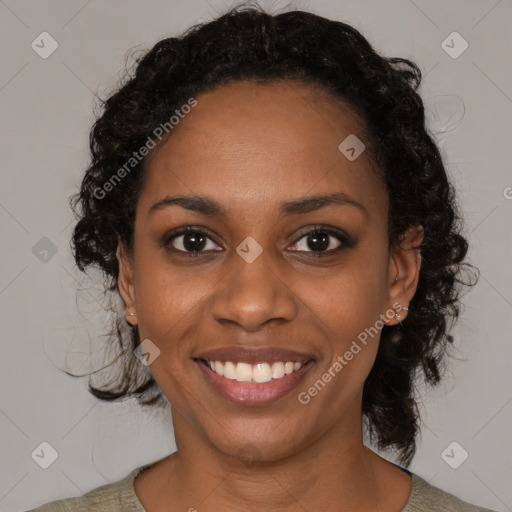 Joyful black young-adult female with medium  black hair and brown eyes