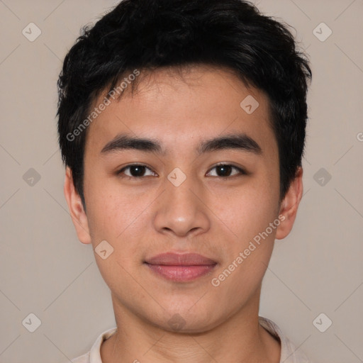 Joyful asian young-adult male with short  black hair and brown eyes