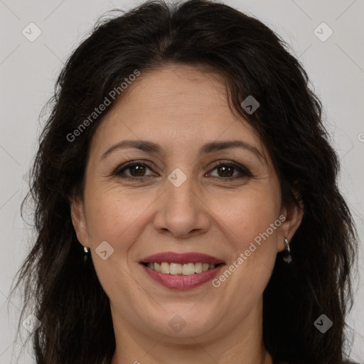 Joyful white adult female with long  brown hair and brown eyes