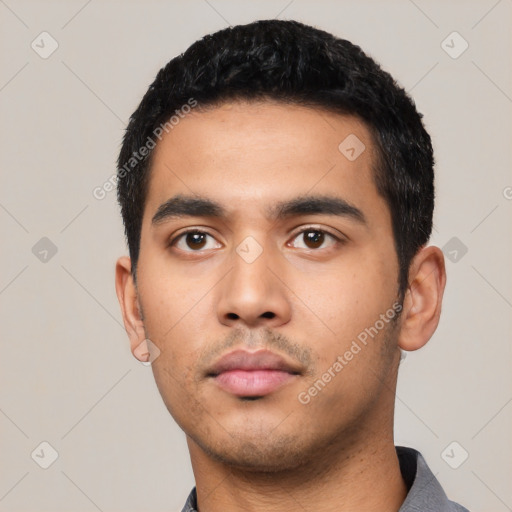 Neutral latino young-adult male with short  black hair and brown eyes