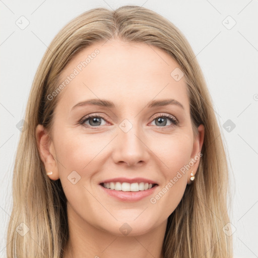 Joyful white young-adult female with long  brown hair and grey eyes