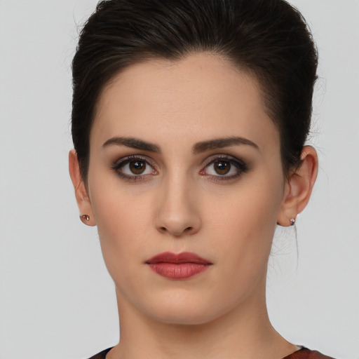 Neutral white young-adult female with short  brown hair and brown eyes