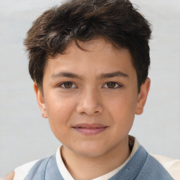 Joyful white child male with short  brown hair and brown eyes