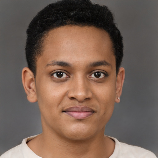 Joyful black young-adult male with short  brown hair and brown eyes