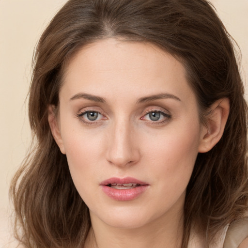 Joyful white young-adult female with long  brown hair and grey eyes