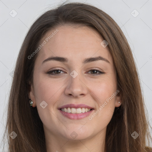 Joyful white young-adult female with long  brown hair and brown eyes