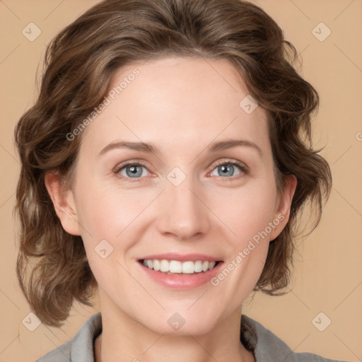 Joyful white young-adult female with medium  brown hair and blue eyes