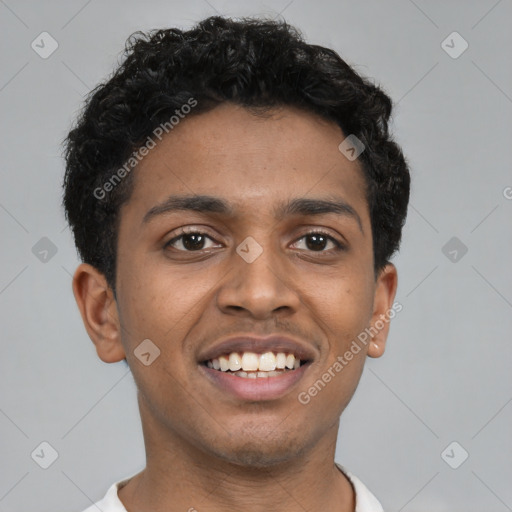 Joyful black young-adult male with short  black hair and brown eyes