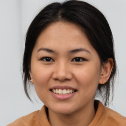 Joyful asian young-adult female with medium  brown hair and brown eyes