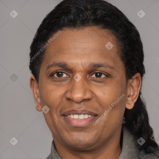 Joyful latino adult male with short  black hair and brown eyes