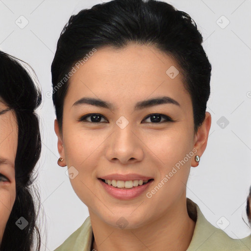 Joyful asian young-adult female with medium  black hair and brown eyes