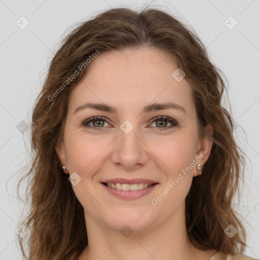 Joyful white young-adult female with long  brown hair and green eyes