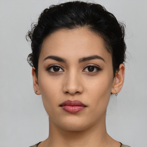 Neutral latino young-adult female with short  black hair and brown eyes