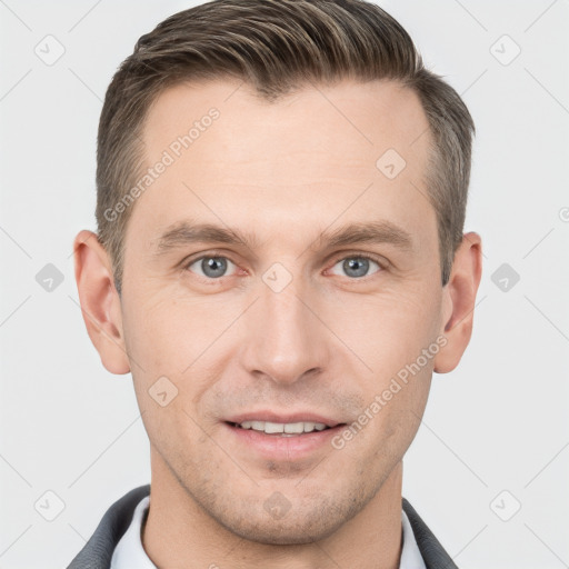 Joyful white young-adult male with short  brown hair and grey eyes