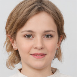 Joyful white young-adult female with medium  brown hair and green eyes