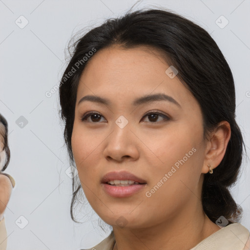 Joyful asian young-adult female with medium  black hair and brown eyes