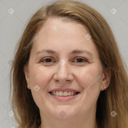 Joyful white adult female with long  brown hair and brown eyes