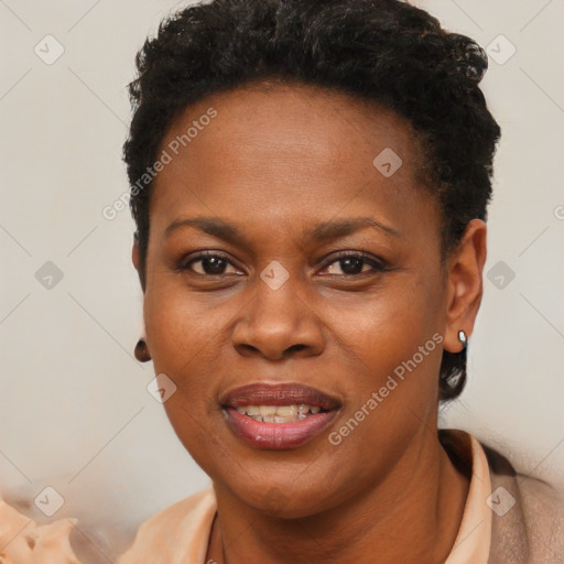 Joyful black young-adult female with short  brown hair and brown eyes