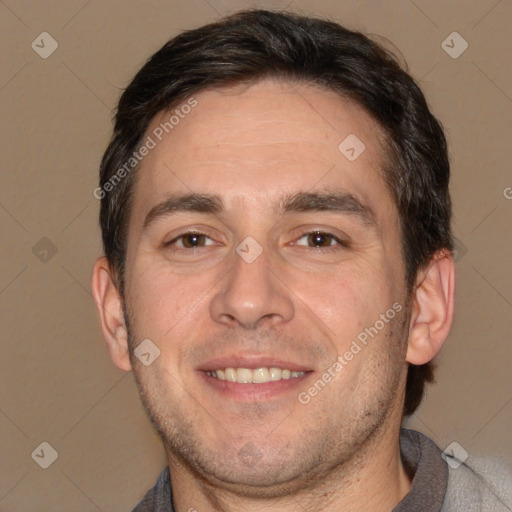 Joyful white adult male with short  brown hair and brown eyes