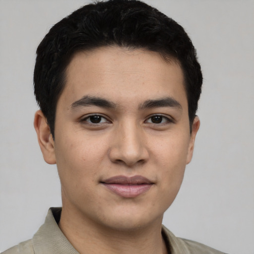 Joyful asian young-adult male with short  black hair and brown eyes