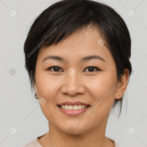 Joyful asian young-adult female with medium  brown hair and brown eyes