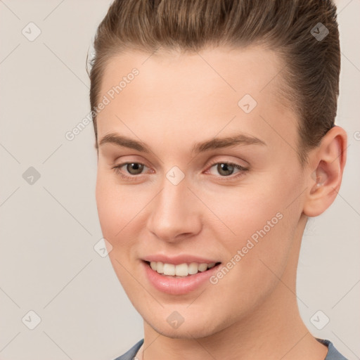 Joyful white young-adult female with short  brown hair and brown eyes