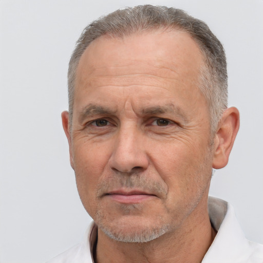 Neutral white middle-aged male with short  gray hair and brown eyes