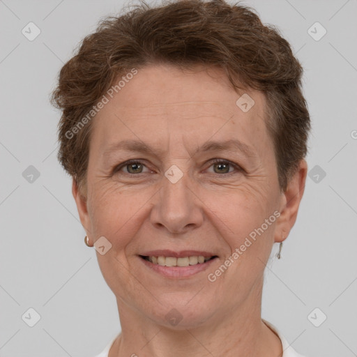 Joyful white adult female with short  brown hair and grey eyes