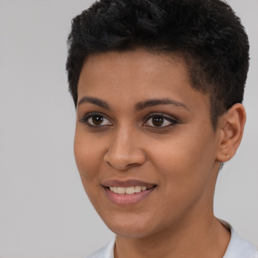 Joyful latino young-adult female with short  brown hair and brown eyes