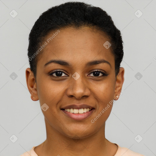 Joyful black young-adult female with short  black hair and brown eyes