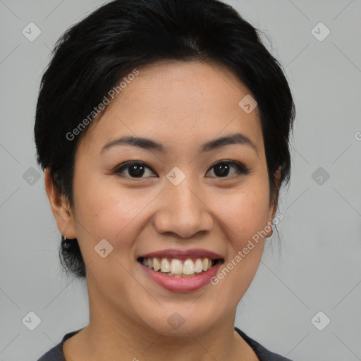 Joyful asian young-adult female with medium  black hair and brown eyes