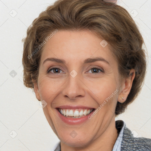 Joyful white adult female with short  brown hair and brown eyes