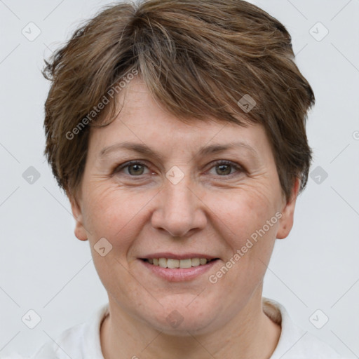 Joyful white adult female with short  brown hair and brown eyes