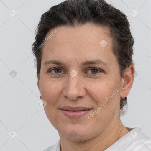 Joyful white adult female with short  brown hair and brown eyes